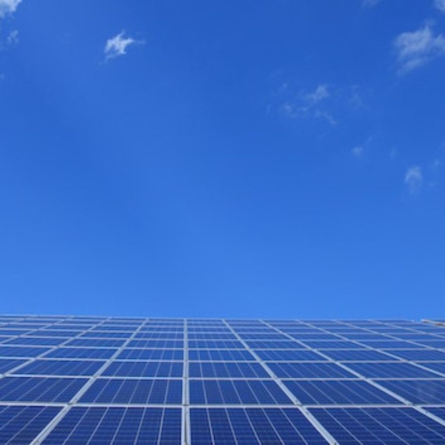 a large solar panel system against a clear blue sky