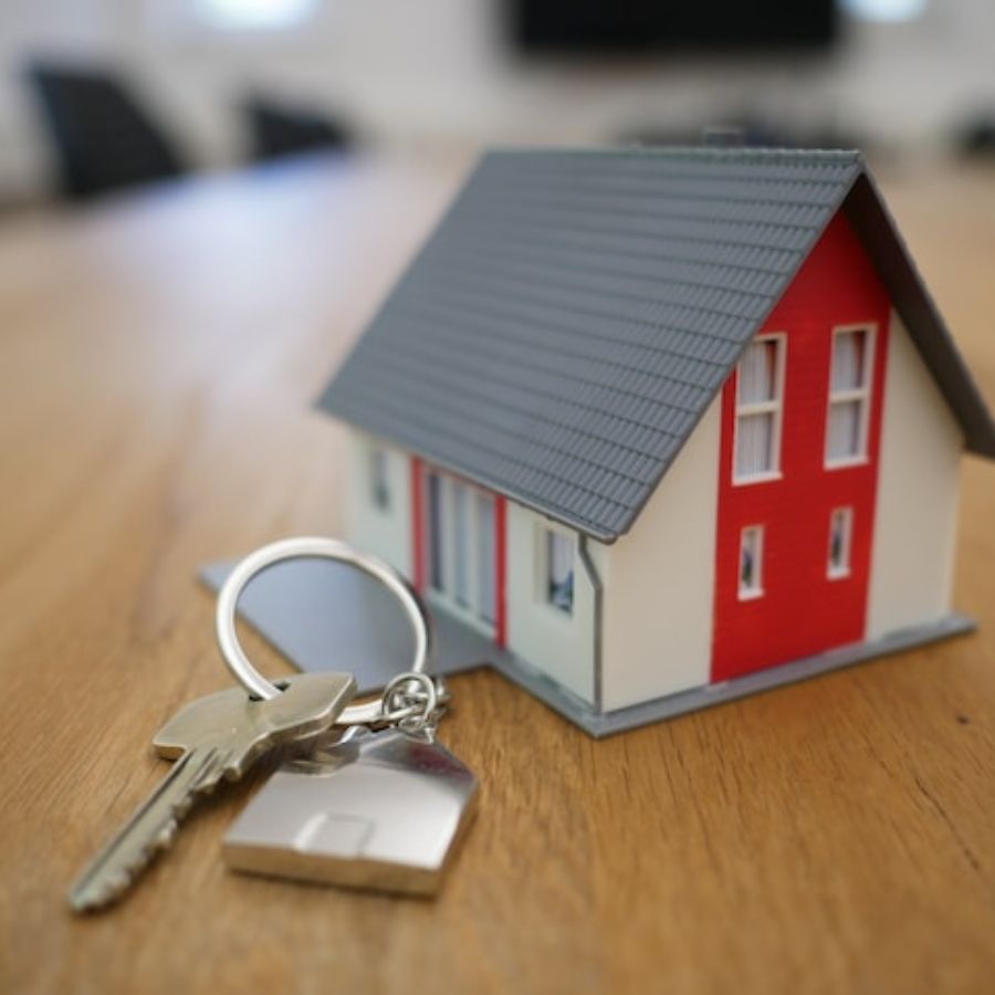 a dummy house with keys next to it