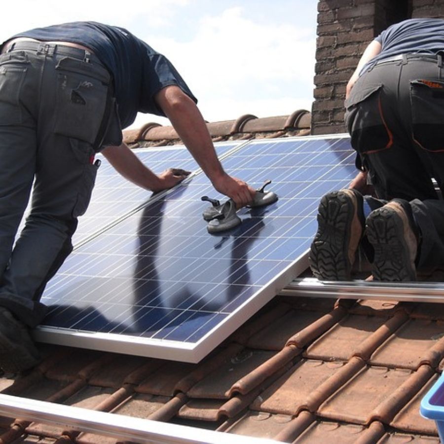 men installing solar panels