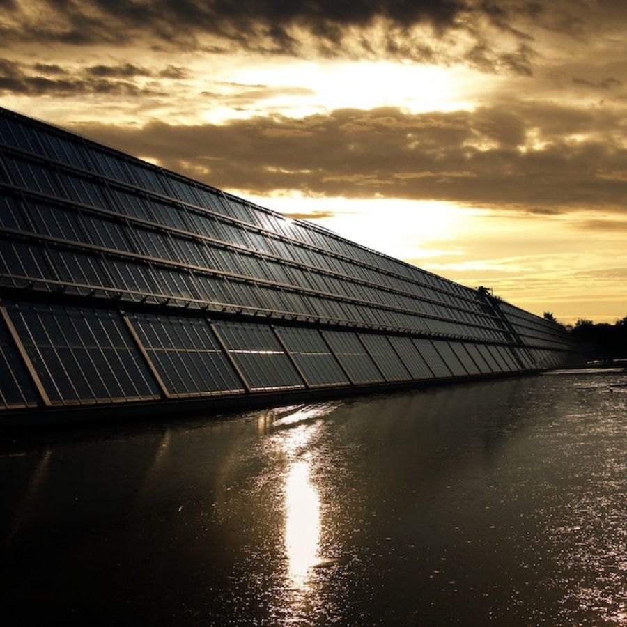 solar panels set against a sun set