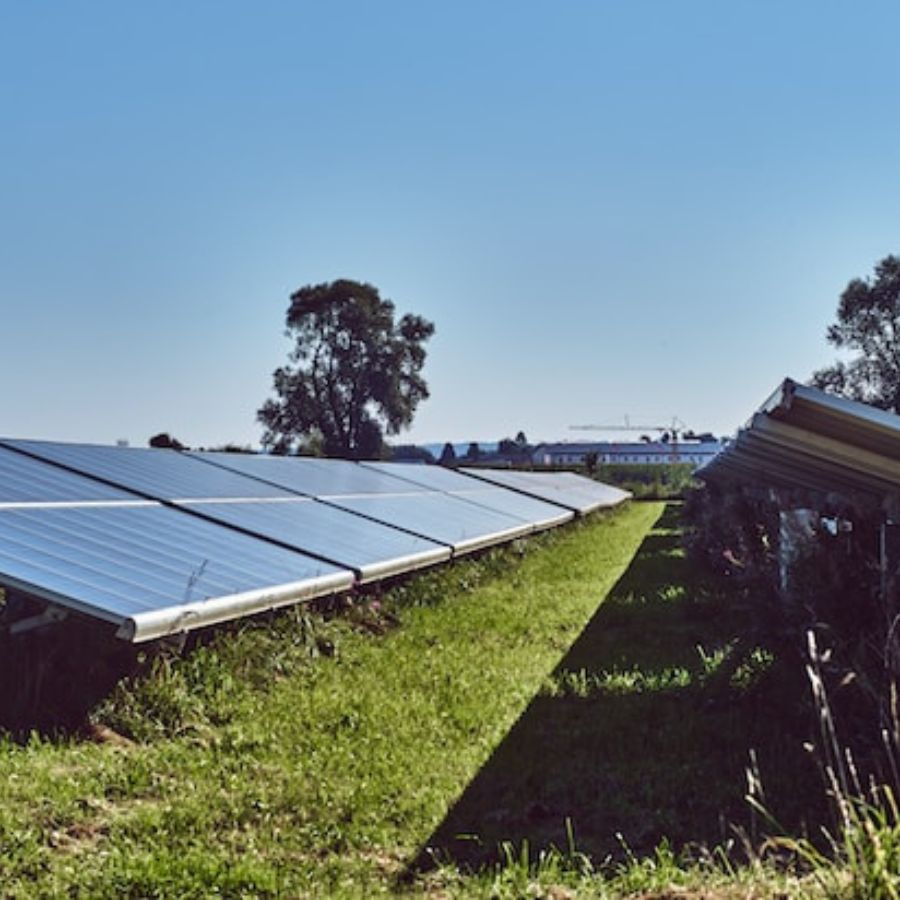 Solar panels on a green grass field